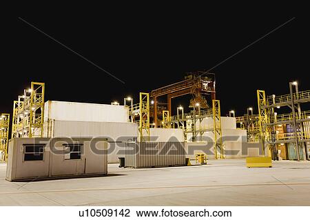 Containers and cranes in shipyard View Large Photo Image Stock Image - Containers and cranes in shipyard. Fotosearch