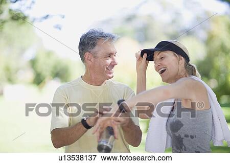 Couple exercising together outdoors View Large Photo Image Stock Photo - Couple exercising together outdoors. Fotosearch