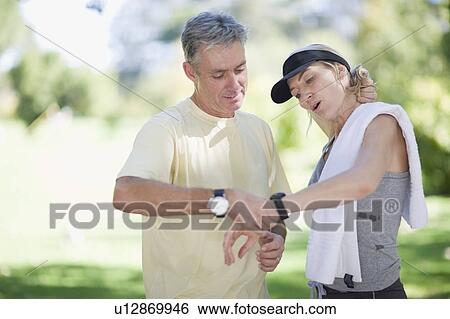 Couple exercising together outdoors View Large Photo Image Stock Photograph - Couple exercising together outdoors. Fotosearch