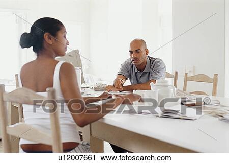 Couple having breakfast in kitchen View Large Photo Image Stock Image - Couple having breakfast in kitchen. Fotosearch