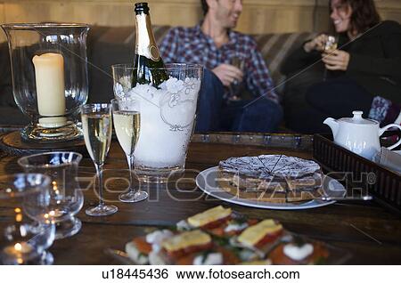 Couple having cake and champagne View Large Photo Image Stock Photograph - Couple having cake and champagne. Fotosearch