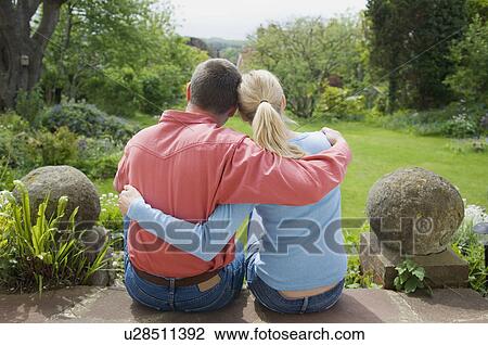 Couple hugging on back porch View Large Photo Image Stock Image - Couple hugging on back porch. Fotosearch