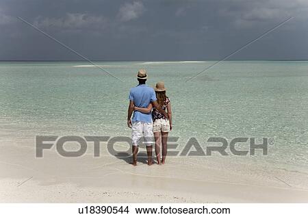 Couple hugging on tropical beach View Large Photo Image Picture - Couple hugging on tropical beach. Fotosearch