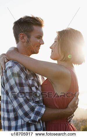 Stock Photo - Couple hugging. Fotosearch