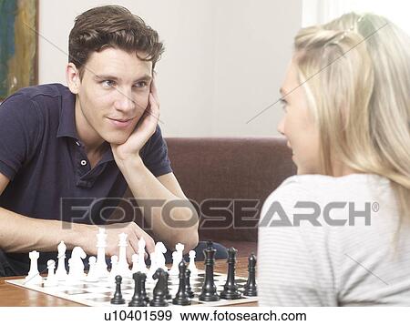Couple playing chess together View Large Photo Image Stock Photo - Couple playing chess together. Fotosearch