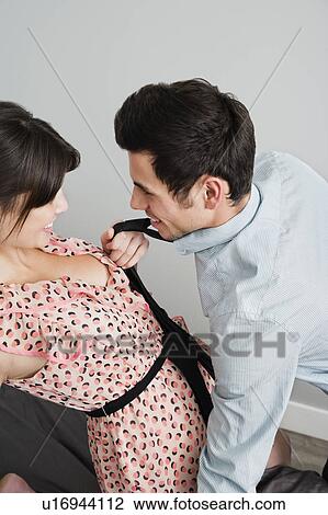 Couple playing on bed together View Large Photo Image Stock Image - Couple playing on bed together. Fotosearch
