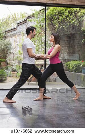 Couple stretching before exercise View Large Photo Image Stock Image - Couple stretching before exercise. Fotosearch