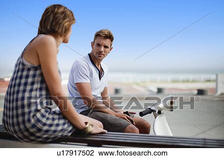 Stock Image - Couple talking outdoors. Fotosearch
