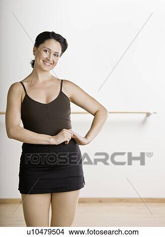 Picture - Dancer standing in studio. Fotosearch