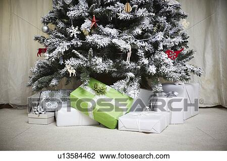 Stock Image - Decorated Christmas tree with gifts. Fotosearch