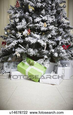 Stock Image - Decorated Christmas tree with gifts. Fotosearch