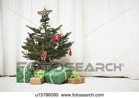 Decorated Christmas tree with gifts View Large Photo Image Stock Image - Decorated Christmas tree with gifts. Fotosearch