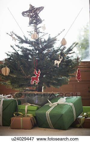 Decorated Christmas tree with gifts View Large Photo Image Stock Photo - Decorated Christmas tree with gifts. Fotosearch