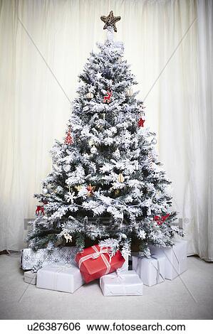 Decorated Christmas tree with gifts View Large Photo Image Stock Photograph - Decorated Christmas tree with gifts. Fotosearch