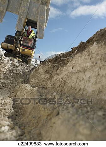 Digger at construction site View Large Photo Image Stock Image - Digger at construction site. Fotosearch