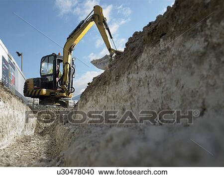Digger at construction site View Large Photo Image Stock Image - Digger at construction site. Fotosearch