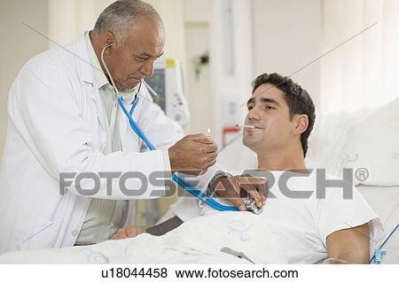 Doctor lighting patient’s cigarette View Large Photo Image Stock Photo - Doctor lighting patient’s cigarette. Fotosearch
