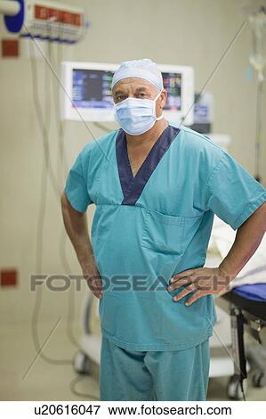 Stock Photo - Doctor wearing mask in hospital. Fotosearch