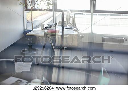 Empty office viewed through window View Large Photo Image Picture - Empty office viewed through window. Fotosearch