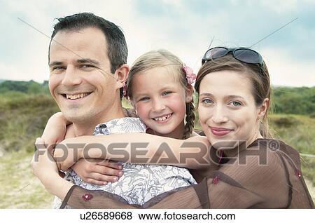 Family smiling together outdoors View Large Photo Image Stock Photo - Family smiling together outdoors. Fotosearch