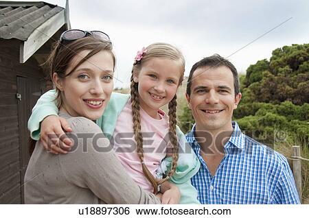 Family standing together outdoors View Large Photo Image Stock Photograph - Family standing together outdoors. Fotosearch