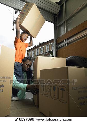 Family unpacking boxes from moving van View Large Photo Image Stock Photograph - Family unpacking boxes from moving van. Fotosearch