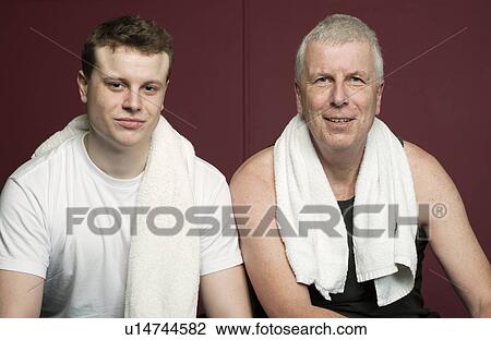 Father and son with towels in gym View Large Photo Image Stock Image - Father and son with towels in gym. Fotosearch