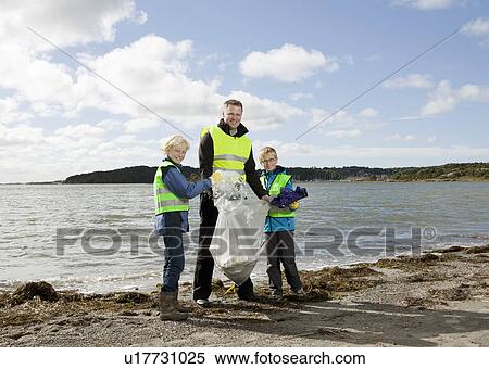 Father and sons cleaning beach View Large Photo Image Stock Photography - Father and sons cleaning beach. Fotosearch