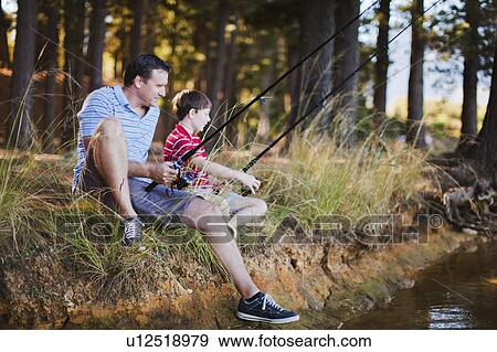 Stock Photo - Father fishing with son in lake. Fotosearch