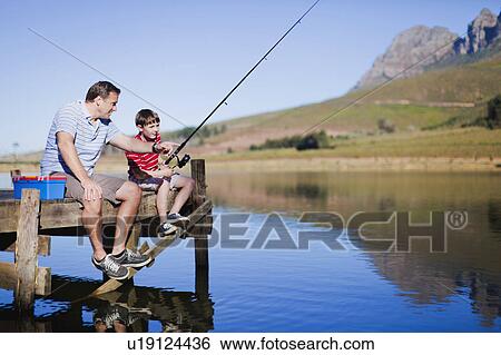 Father fishing with son in lake View Large Photo Image Stock Photograph - Father fishing with son in lake. Fotosearch