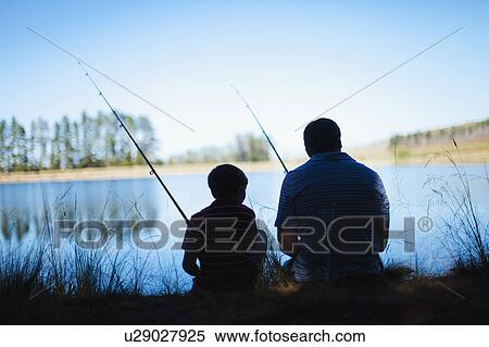 Father fishing with son in lake View Large Photo Image Stock Photography - Father fishing with son in lake. Fotosearch