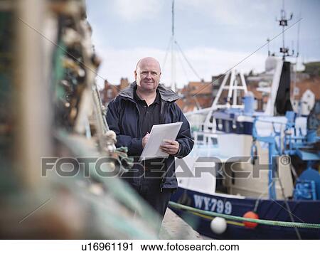 Fish inspector on fishing boat View Large Photo Image Stock Image - Fish inspector on fishing boat. Fotosearch