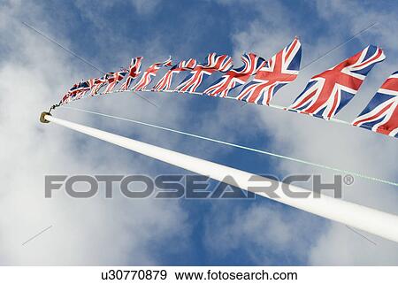 Flagpole with British flags View Large Photo Image Stock Photo - Flagpole with British flags. Fotosearch