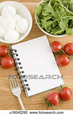 Stock Image - Food journal with bowls of food. Fotosearch