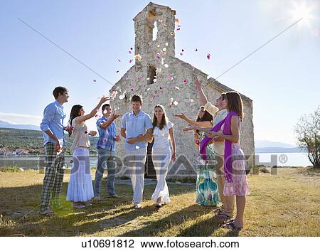 Friends celebrating newlywed couple View Large Photo Image Stock Image - Friends celebrating newlywed couple. Fotosearch