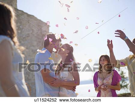 Stock Image - Friends celebrating newlywed couple. Fotosearch