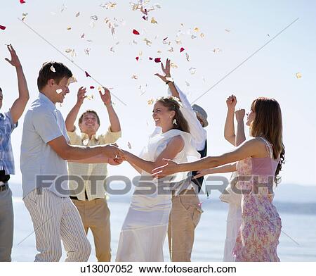 Friends celebrating newlywed couple View Large Photo Image Stock Image - Friends celebrating newlywed couple. Fotosearch
