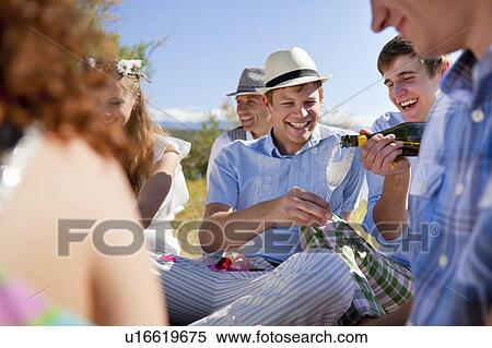 Friends drinking champagne outdoors View Large Photo Image Stock Photography - Friends drinking champagne outdoors. Fotosearch