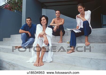 Friends sitting on steps outdoors View Large Photo Image Stock Image - Friends sitting on steps outdoors. Fotosearch