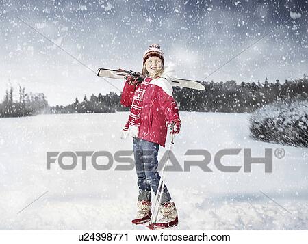 Girl carrying cross country skis in snow View Large Photo Image Stock Image - Girl carrying cross country skis in snow. Fotosearch