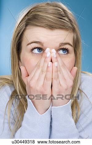 Girl covering her mouth with hands View Large Photo Image Stock Photo - Girl covering her mouth with hands. Fotosearch