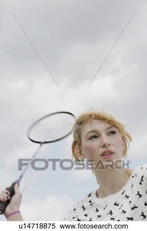 Girl playing badminton outdoors View Large Photo Image Stock Photography - Girl playing badminton outdoors. Fotosearch