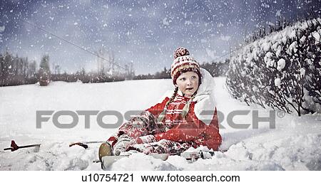 Stock Image - Girl putting on cross country skis. Fotosearch