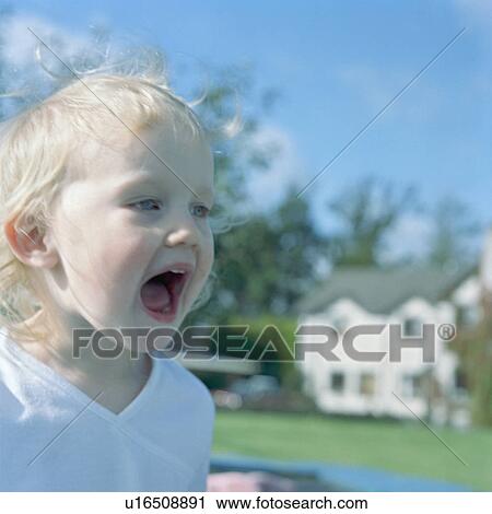 Girl shouting in backyard View Large Photo Image Stock Image - Girl shouting in backyard. Fotosearch