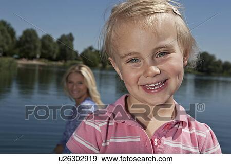 Girl smiling outdoors View Large Photo Image Stock Photo - Girl smiling outdoors. Fotosearch