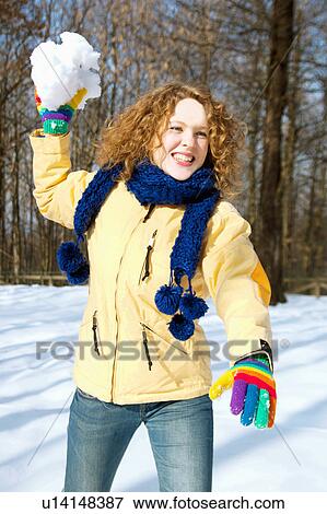 Girl throwing a snowball View Large Photo Image Stock Photo - Girl throwing a snowball. Fotosearch