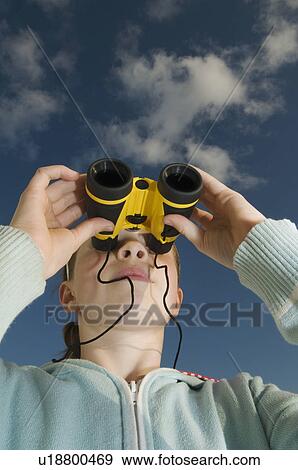 Girl using binoculars outdoors View Large Photo Image Stock Photo - Girl using binoculars outdoors. Fotosearch