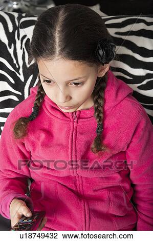Girl watching television View Large Photo Image Stock Image - Girl watching television. Fotosearch