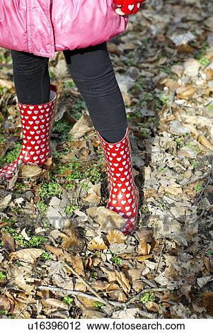 Girl wearing colorful rainboots View Large Photo Image Stock Image - Girl wearing colorful rainboots. Fotosearch