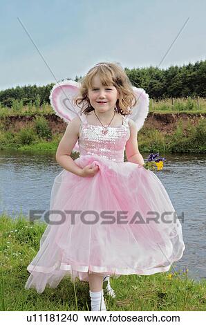 Girl wearing fairy costume by creek View Large Photo Image Stock Image - Girl wearing fairy costume by creek. Fotosearch